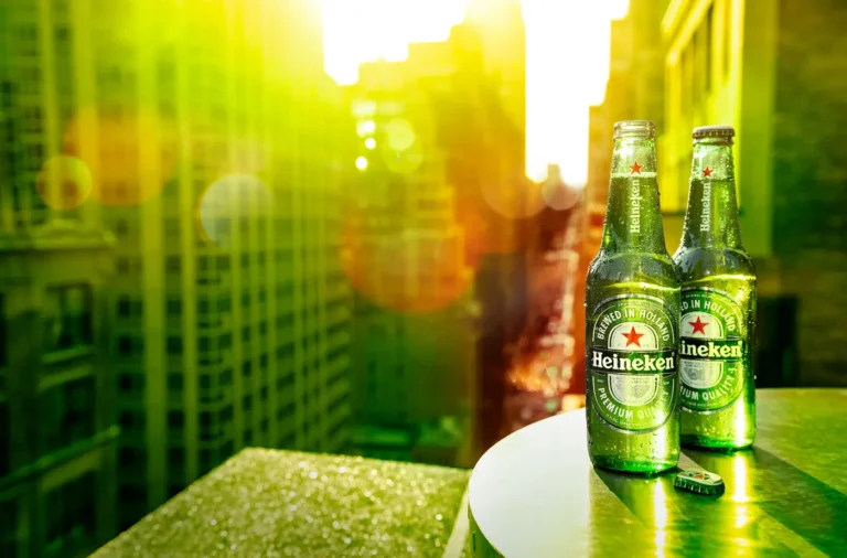 Two chilled bottles of heineken overlooking Manhattan