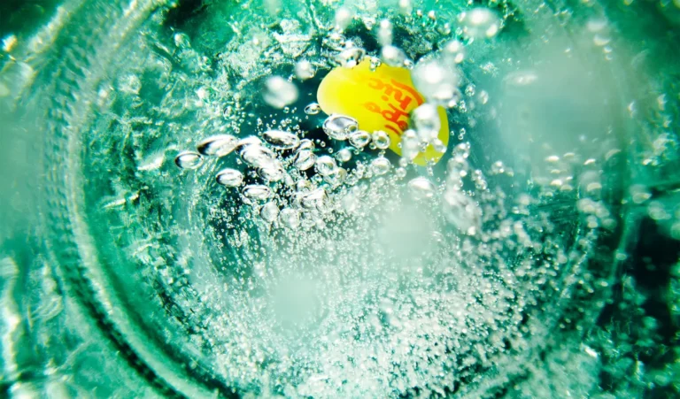 Topo Chico Overhead view heavy carbonation bubbles.