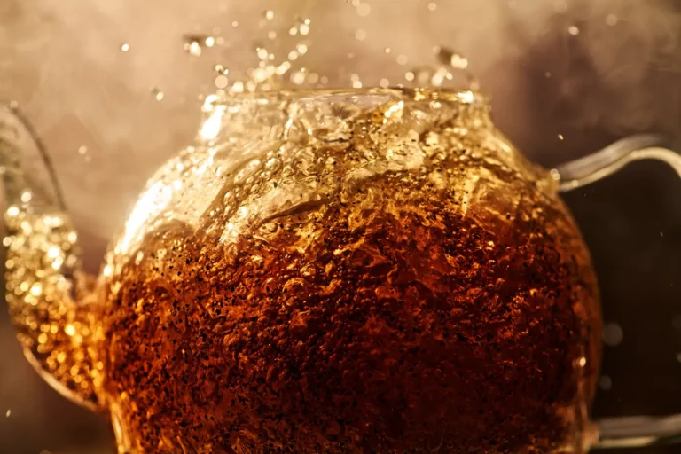 Lipton Macro view of golden whiskey swirling with heavy carbonation and bubbles.