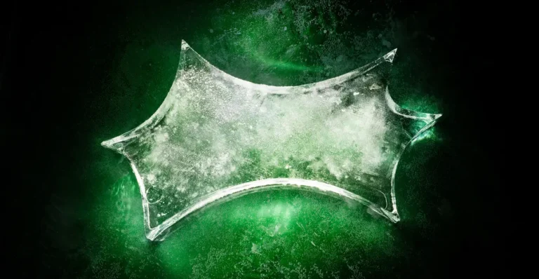 Extreme close-up of a green Sprite bottle submerged in bubbling water.